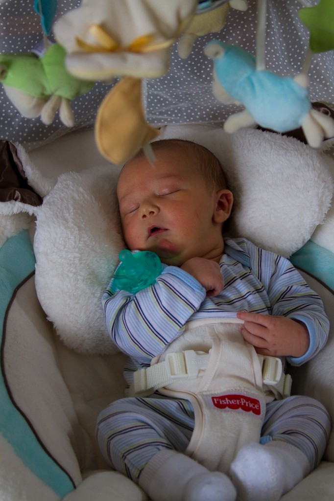 Eli asleep in the swing