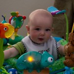 Eli Playing In His Exersaucer