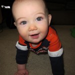 Eli Crawling and Smiling For the Camera