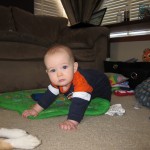 Eli crawling in Broncos Gear