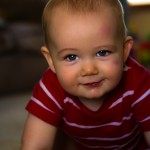 The smile of happy boy playing