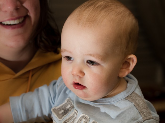 Eli looks at Daddy's flash, not the camera.